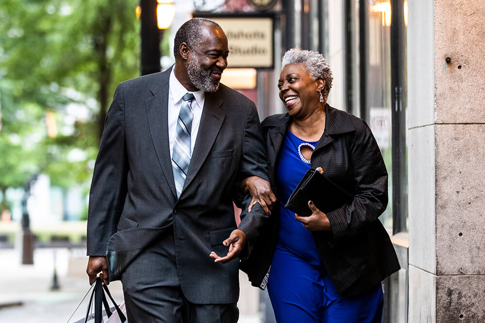Couple walking down street together