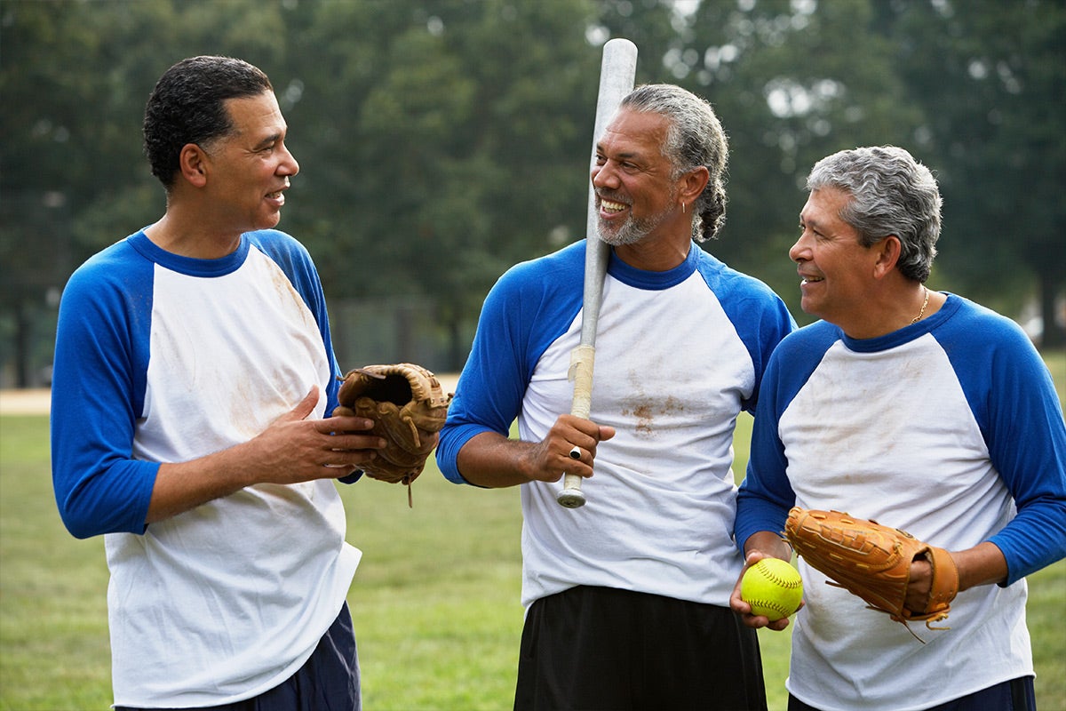 Group of men playing softball