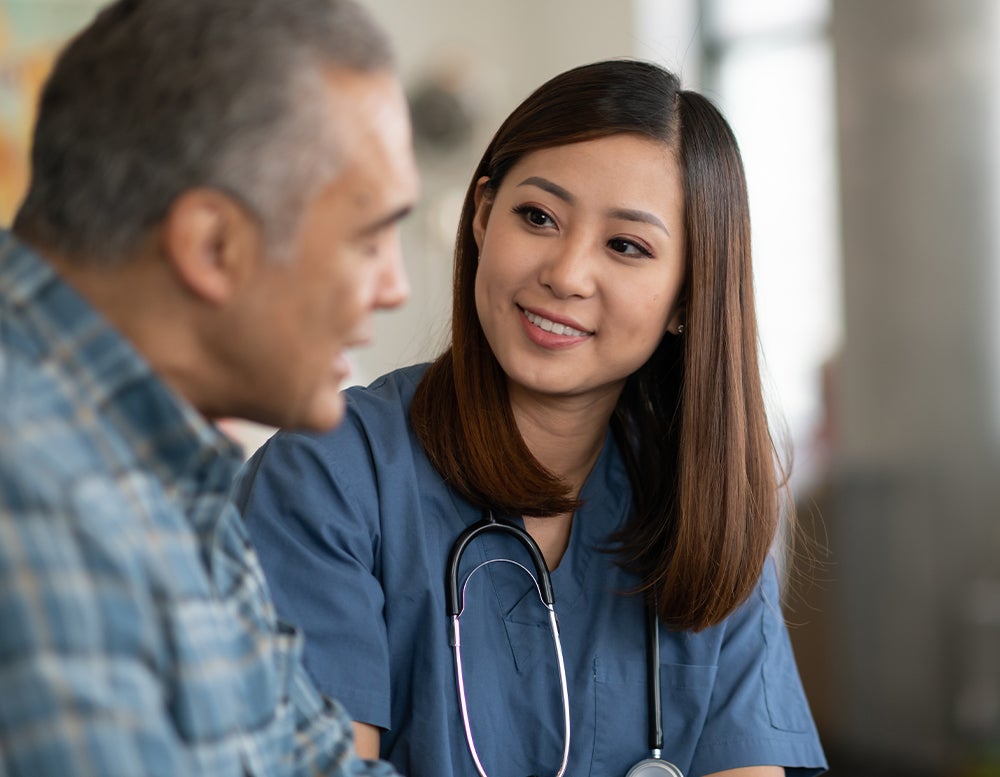 Doctor talking to male patient